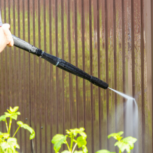 Pressure washing  dirty metal fence